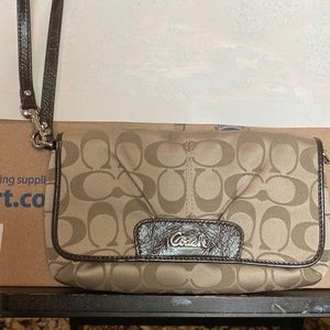 Coach wristlet brand new without tags. Received as a gift and never used.